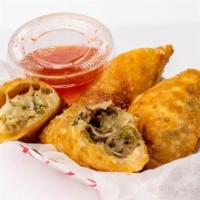 Philly Cheesesteak Egg Rolls · Cut in half with house dipping sauce
