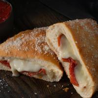 Jet'S Boat® · Calzone style sandwich baked with pizza dough and stuffed with premium mozzarella & your fav...