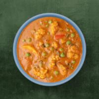 Classic Veggie Curry · Fresh seasonal vegetables sautéed to perfection with herbs, ground spices, red onions, and p...