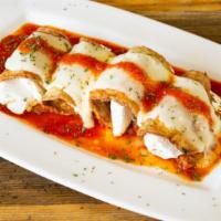 Eggplant Rollatini · Delicious Eggplant Rollatini dish served with customer's choice of pasta and 2 garlic rolls.