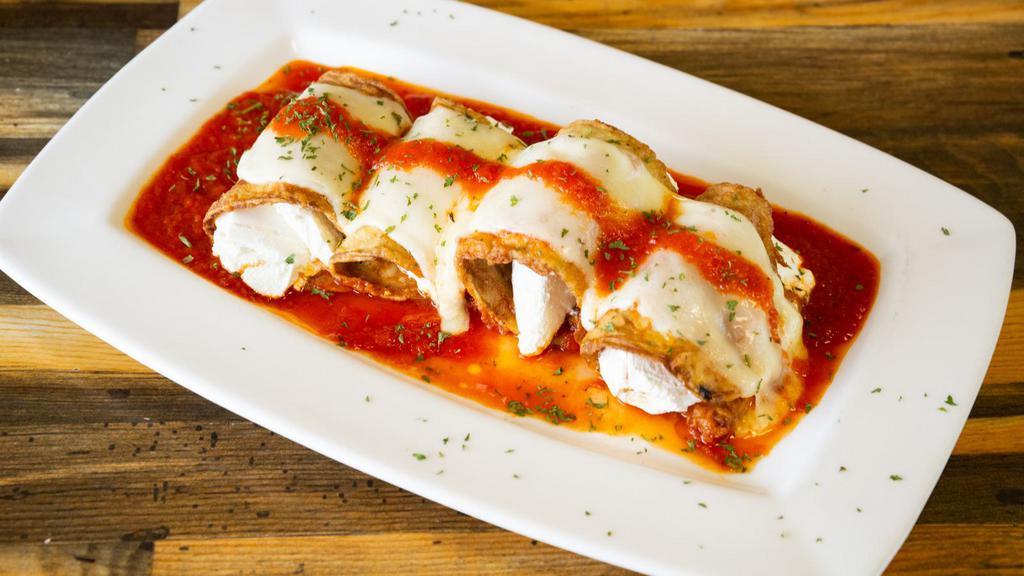 Eggplant Rollatini · Delicious Eggplant Rollatini dish served with customer's choice of pasta and 2 garlic rolls.