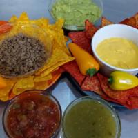 Nachos · Your choice of beef, chicken or steak. Select your choice of chips. Comes with shredded chee...