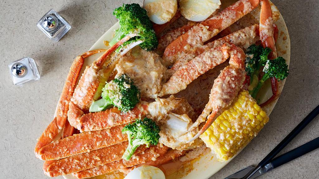 Snow Crab Legs(1 Cluster) · ENTREE SERVED  1 SNOW CRAB CLUSTER WITH KAJUN GARLIC BUTTER SAUCE (with sides +$3.99)
