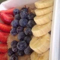 Oatmeal · Topped with strawberry, banana, and blueberry