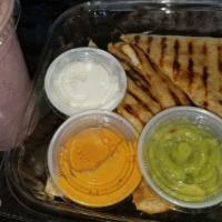 Guarapo Chicken Quesadilla · Chicken breast and shredded cheddar cheese on a whole wheat tortilla. Served with avocado pu...