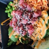 Ahi Poke Bowl · Ahi tuna marinated in ponzu sauce, seaweed salad, edamame, shredded carrots and cucumber on ...