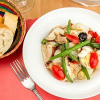 Nicoise Salad · Green beans, Tomatoes, Olives, Hard eggs, Potatoes, Green pepper & Tuna.
