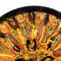 Seafood Paella · Jumbo head-on shrimp, squid, octopus, mussels, prawns, peppers, rice (bomba type), saffron *...