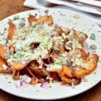 Bleu Cheese Chips · Our homemade potato chips topped with a creamy white sauce, bleu cheese crumbles, tomato and...