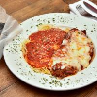 Chicken Parmesan · Hand breaded chicken breast topped with marinara, parmesan and mozzarella cheese. Served wit...