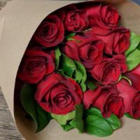 Red Roses - 12 Stems Wrapped  · Our dozen red rose arrangements are wrapped, completed with greens.