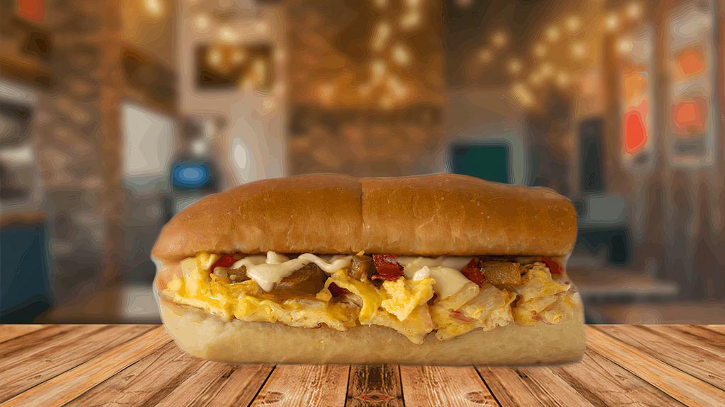 Scrambler · The Scrambler is an eggs-cellent choice to start your day. Scrambled eggs and white American cheese are mixed with diced tomatoes, grilled onions, and loaded into a toasted half sub roll