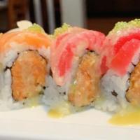 Fire Island Roll · Spicy crunchy tuna, topped with salmon, tuna and wasabi tobiko, served with honey wasabi sau...