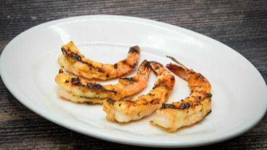 Grilled Shrimp · Served with a side & your choice of dinner Caesar salad, dinner salad (with a choice of honey-mustard, chunky bleu cheese, ranch, Thousand Island or balsamic vinaigrette), or upgrade to a wedge salad.