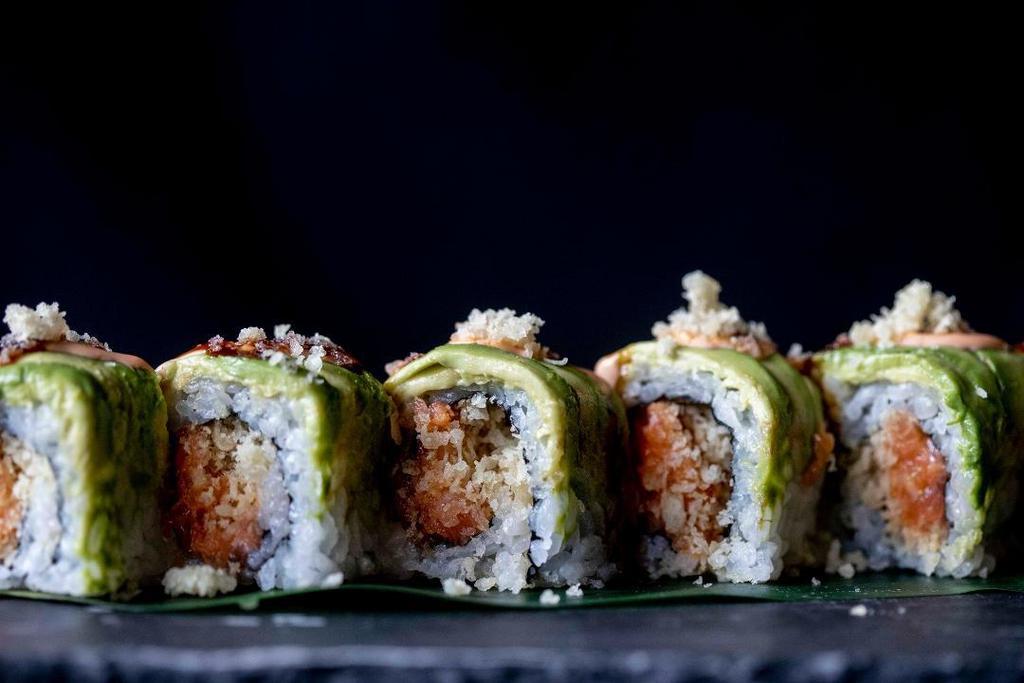 King Kong Roll · inside: spicy salmon, scallion, and tempura flakes outside: avocado, spicy aioli, eel sauce, and tempura flakes