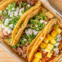 Taco Plate · Two Tacos  with Cilantro and Onion 
Rice and Beans