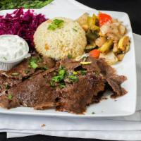 Doner Kebab (Turkish Gyro) · Hand-carved lamb and beef, tzatziki, white rice, red cabbage, sautéed vegetables.