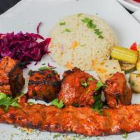 Mixed Grill Kebab · Half portions of Chicken, Kofta, Lamb Adana, Lamb Shish Kebabs, white rice, red cabbage, sau...