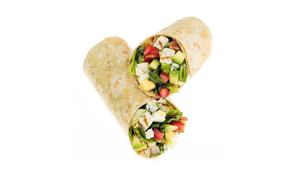 Avocado Cobb Wrap · Fresh Avocado enhances this timeless classic! Start with a flour tortilla and recommended base of our Romaine/Iceberg Blend. It is served with Crispy Chicken, Diced Tomatoes, Fresh Avocado, Sliced Egg, Smoky Bacon and Bleu Cheese. We recommend our Thousand Island dressing.