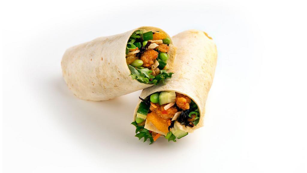Asian Crispy Chicken Wrap · Enjoy the flavors of Asia with our Asian Crispy Chicken wrap! Served in a flour tortilla with a recommended base of our Super Greens Blend topped with Sweet Chili Crispy Chicken, Mandarin Oranges, Sliced Cucumbers, Matchstick Carrots, Edamame, and Crispy Wonton Strips. We recommend our Sweet Sesame dressing.