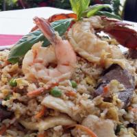 Royal Surf & Turf Fried Rice · Angus Steak, lobster tail, jumbo shrimp and breast of chicken, wok tossed with vegetables, e...