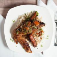 Turkey Wing Dinner · Braised Turkey Wings served on a bed of rice