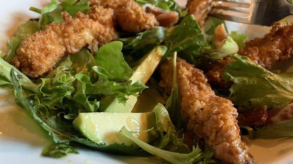 Crispy Chicken Salad · Crispy chicken, spring mix, avocado, cucumbers, tomatoes, bacon, cilantro-chive dressing.