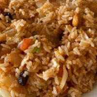Pineapple Fried Rice · Stir fried egg with steamed rice, pineapple, raisins, tomatoes, onion, scallions, and cashew...
