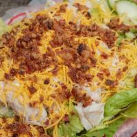 Turkey, Cheddar & Bacon Salad · Fresh turkey, cheddar cheese and real bacon crumbs combined over a large plate of green sala...