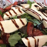 Caprese Salad · Sliced tomato, fresh Mozzarella cheese, and fresh basil leave drizzled with balsamic glaze a...