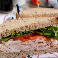 Turkey Sandwich · Freshly cut oven roasted turkey breast, made-to-order on your choice of bread, served with l...