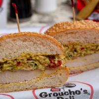 S.M. Chicken Critter · Marinated chicken breast covered with herb slaw and formula “95” sauce in a soft seeded roll...