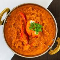14 Chicken Tikka Masala · Grilled chicken breast cooked with onion, tomato sauce, cream and Indian spices. come with s...