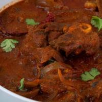 7 Lamb Vindaloo · Lamb cooked with potato cubes in a spice filled sauce. 
come with side of basmati rice.