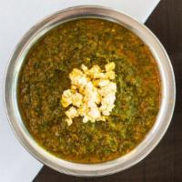 23 Palak Paneer · Fresh spinach puree with cottage cheese, cooked with cream and butter. come with side of bas...