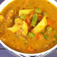 21 Vegetable Curry · Fresh mixed vegetables stir-fried in a sauce with Indian spices and come with side of basmat...