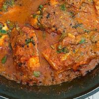 30 Fish Curry · Fried fish cooked with onion, tomato, ginger, garlic, curry sauce and Indian spice. come wit...