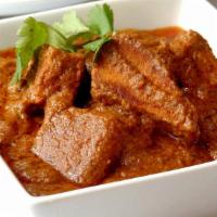 31 Fish Vindaloo · Fried fish cooked with potato, onion, tomato, ginger, garlic, curry sauce and Indian spice. ...