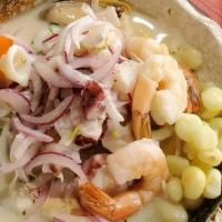 Ceviche Mixto · Fish and seafood marinated in lime juice.