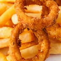 Fried Calamari With French Fries · Lightly dusted calamari rings and tentacles with fries.