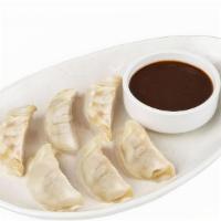 Chicken Dumplings · Steamed dumplings filled with chicken, cabbage, shallots, ginger and scallions.