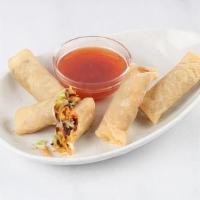 Vegetable Spring Roll · Crispy wrap filled with cabbage, green onions, noodles, mushrooms and carrots.