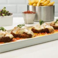 Milanesa De Pollo​ · Crispy chicken breast topped with homemade tomato sauce and melted mozzarella cheese served ...