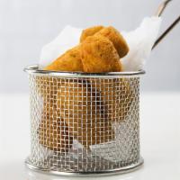 Croquetas​ · Ham or chicken croquettes served with house sauce.