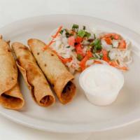 Beef Tacos · Three pieces. Beef tacos with cream and cabbage salad.