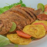Creole Whole Fish Pargo A La Tipitapa · Large Grilled fish filet. Whole fish Pargo with white rice , tostones or maduros, and Col sa...