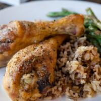 Herb Roasted Chicken · Oven roasted chicken thighs with two sides.