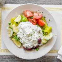 Tzatziki Appetizer · Homemade cucumber dip with Greek yogurt, fresh garlic, olive oil, lemon, and dill.