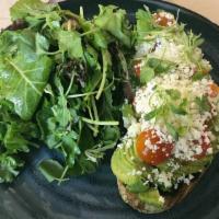 Avocado Tartine · Sourdough, cotija cheese, avocado mousse, heirloom tomato, micro cilantro.
