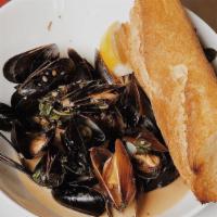 Mussels · PEI mussels in a spicy brown ale & cream broth with red pepper flakes, basil & butter.  Serv...